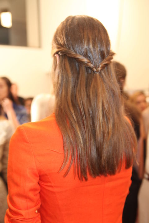 The detail was at the back for the Altuzarra models this NYFW. Stylist Odile Gilbert for Moroccanoil explained how to achieve the twisted 'V': "With each hand, grab a section of hair from the front of each side of the head. Begin to pull these two sections of the hair away from the face, twisting them back and away from the face. Secure low with a clear elastic, creating a "V" shape with the hair." Do try this at home.