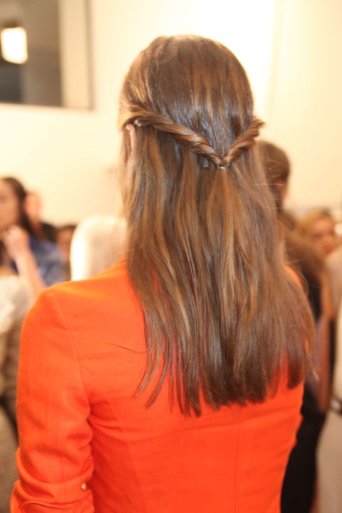 The detail was at the back for the Altuzarra models this NYFW. Stylist Odile Gilbert for Moroccanoil explained how to achieve the twisted 'V': "With each hand, grab a section of hair from the front of each side of the head. Begin to pull these two sections of the hair away from the face, twisting them back and away from the face. Secure low with a clear elastic, creating a "V" shape with the hair." Do try this at home.
