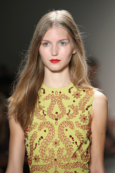 The Spring-perfect makeup here was all about pops of colour. Makeup artist Talia Sparrow applied the Laura Mercier Crème Eye Liner in Canard using an angled eyeliner brush in line with the models' eye shapes. On the lips she applied the Laura Mercier Lip Pencil in True Red with the Laura Mercier Paint Wash Liquid Lip Colour in Vermillion Red on top.